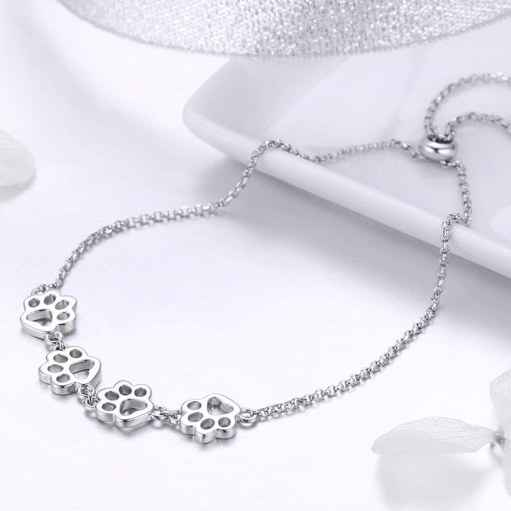 Pulsera de plata ajustable con diseño de huella de perro
