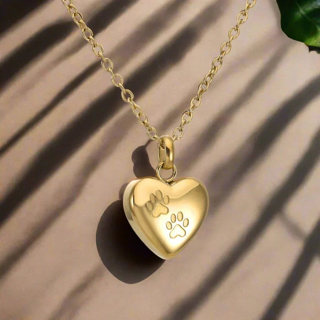Colgante de Acero Inoxidable con Diseño de Patas y Corazón – Recipiente para Cenizas