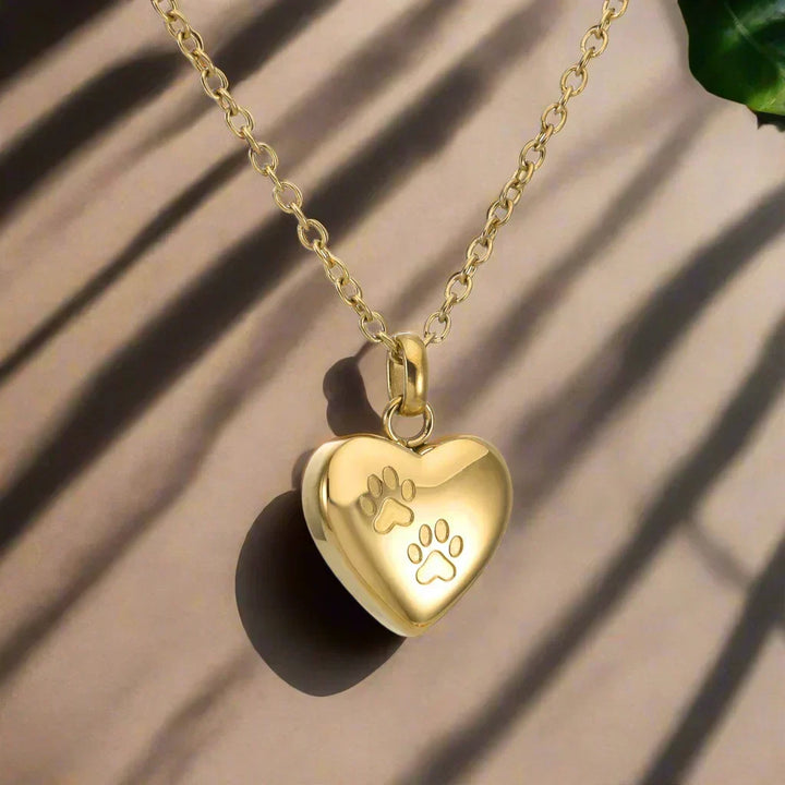 Colgante de Acero Inoxidable con Diseño de Patas y Corazón – Recipiente para Cenizas