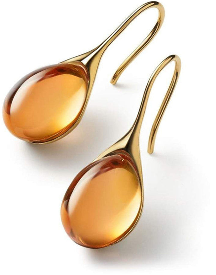 "Pendientes de Cristal en Oro y Plata" can be rewritten as "Aretes de Cristal en Oro y Plata".